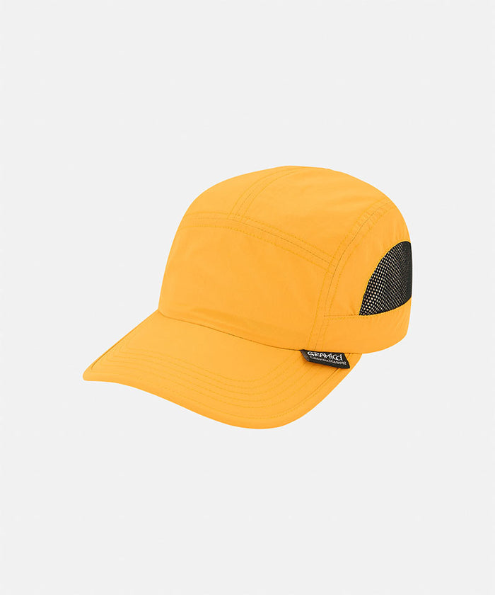 Mango colored Gramicci Guide Cap against a light-tone background.