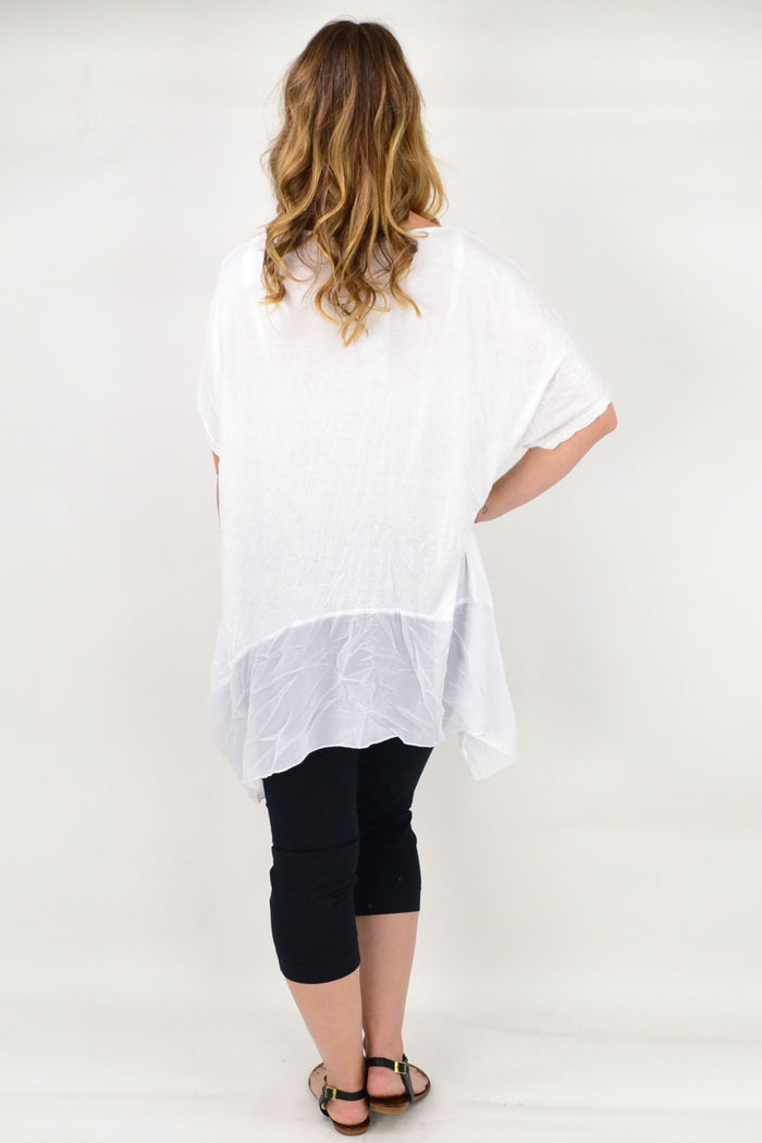 White Heron Island Tunic by I Love Tunics, featuring lightweight fabric and relaxed fit, displayed on a hanger against a neutral background.