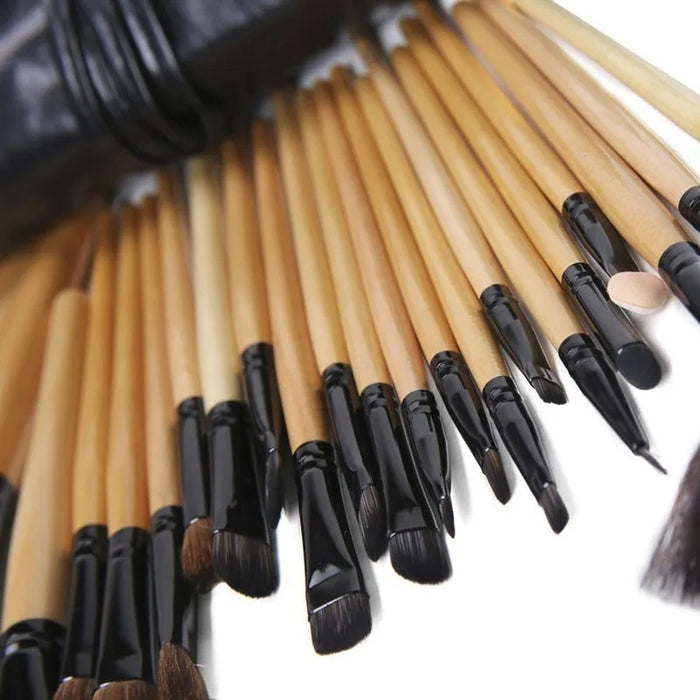 Full-length wooden makeup brush handles with matte black finish and rose-gold ferrules