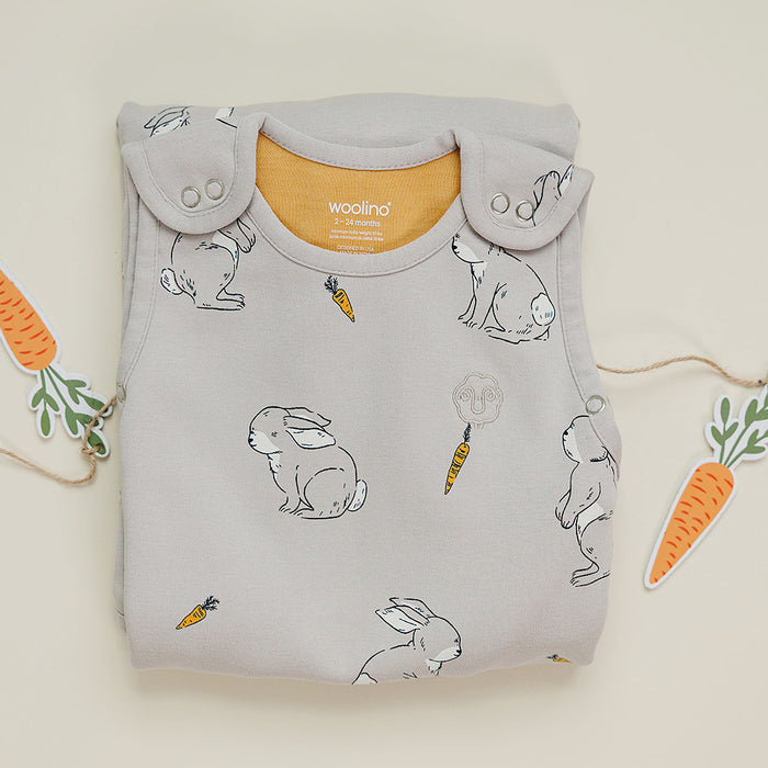 Folded baby sleep sack with bunny print on a light background