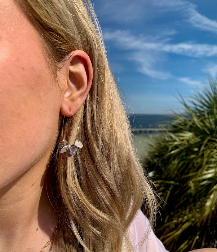 Carly pearl earrings on model.