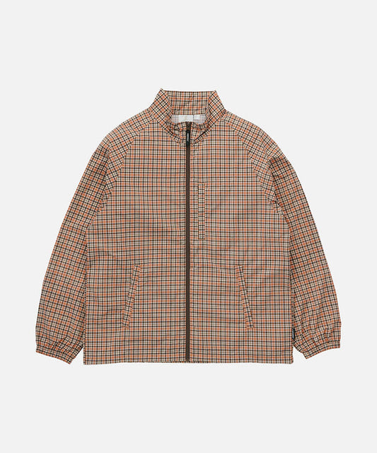 Gramicci brick colored Checkered Shell Jacket against a light-tone background.
