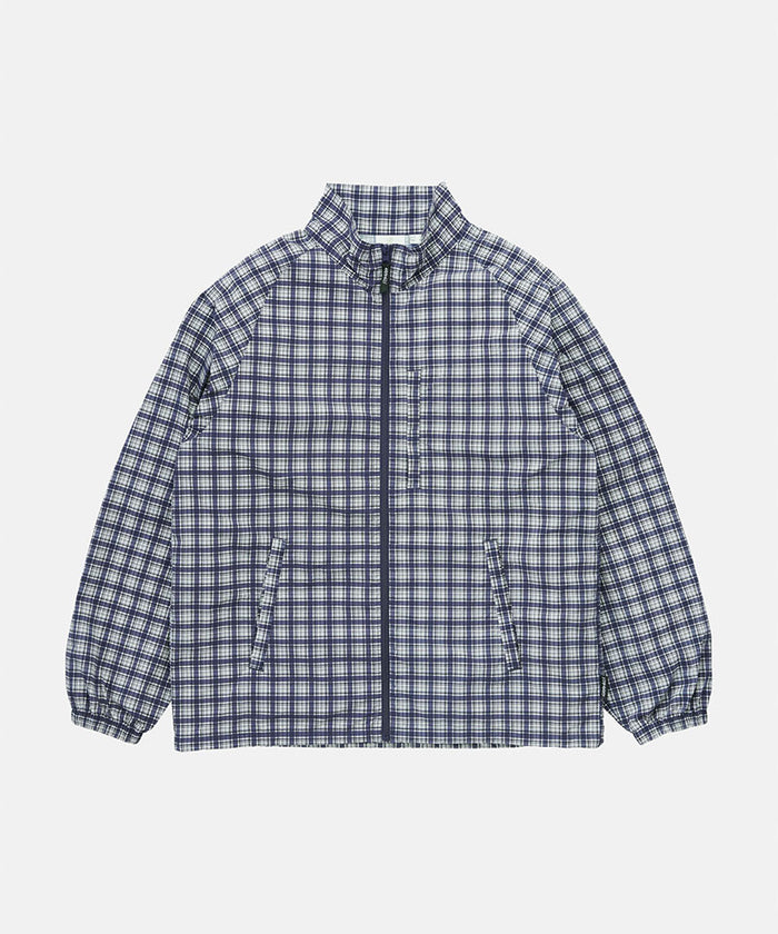 Gramicci navy check Checkered Shell Jacket against a light-tone background.