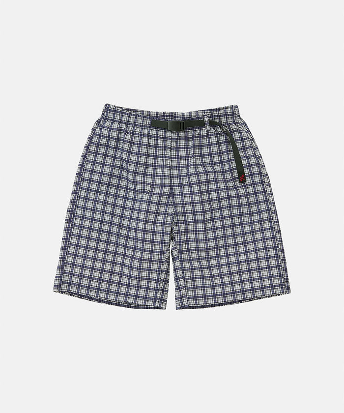 Navy check colored Gramicci Checkered Shell Shorts with a black belt against a light-tone background.