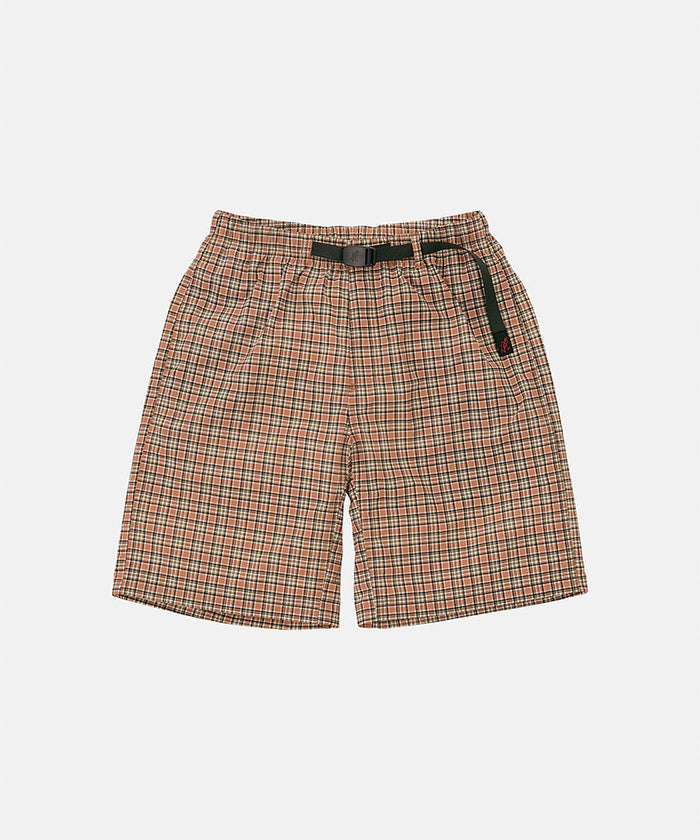 Brick check colored Gramicci Checkered Shell Shorts with a black belt against a light-tone background.
