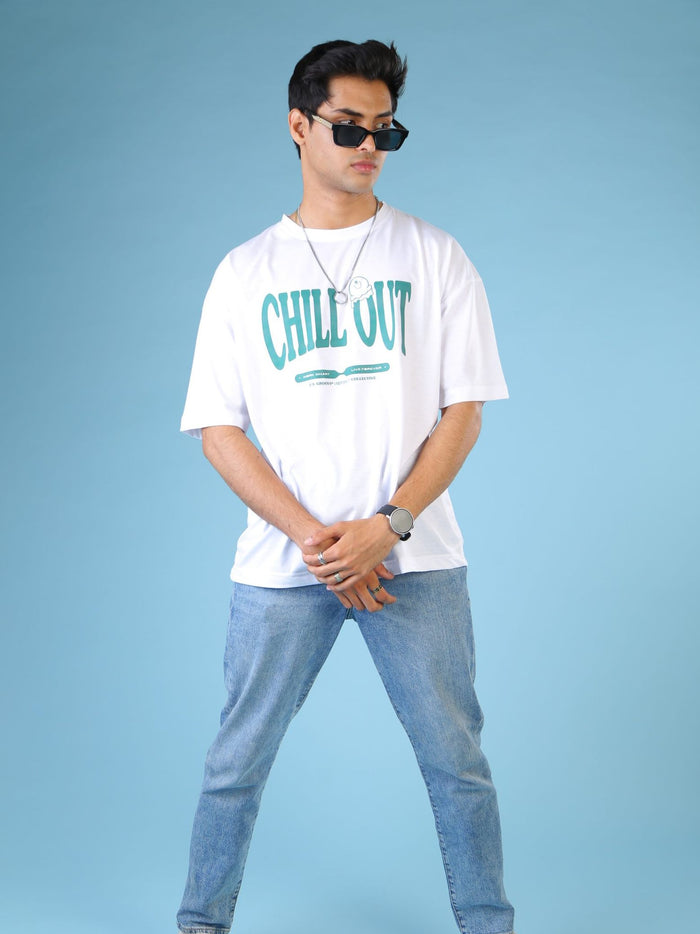 White Oversized Tee Male Model Side Angle – Chill Out – GROOVY Pakistan