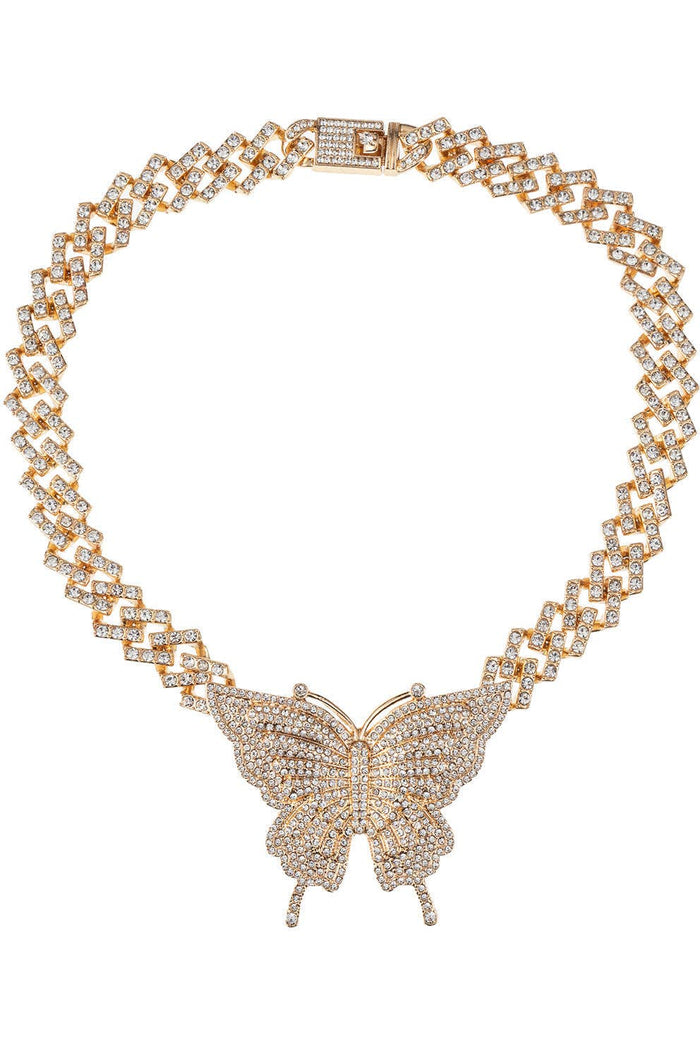 Gold-tone Cuban link necklace with a crystal-embellished butterfly pendant for a bold glam statement.