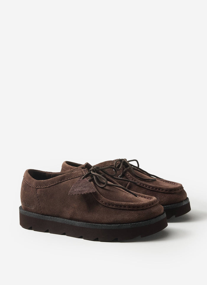 A pair of the dark brown suede Meare Walla shoes from the Percival x Clarks Originals collaboration, on a white background.
