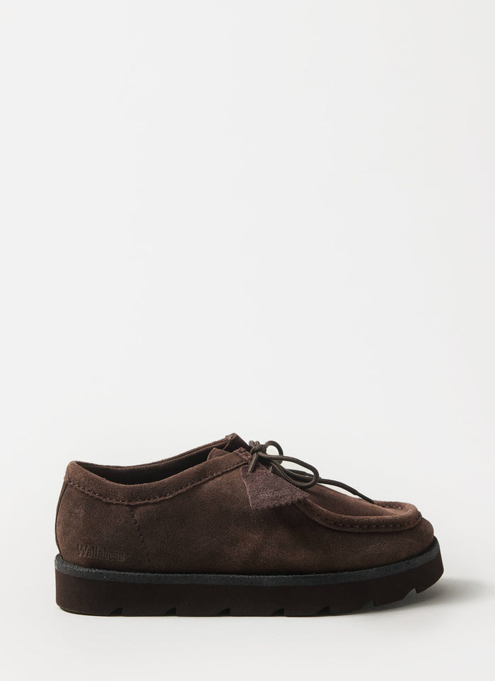 A side-on studio shot of the Clarks Originals Meare Walla shoe in dark brown suede, from the Percival collection.
