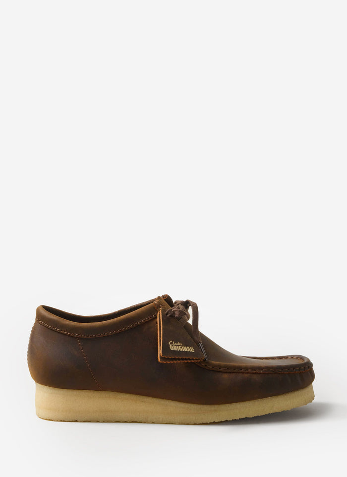 A side profile of the Clarks Originals Wallabee shoe in beeswax brown leather, available at Percival.