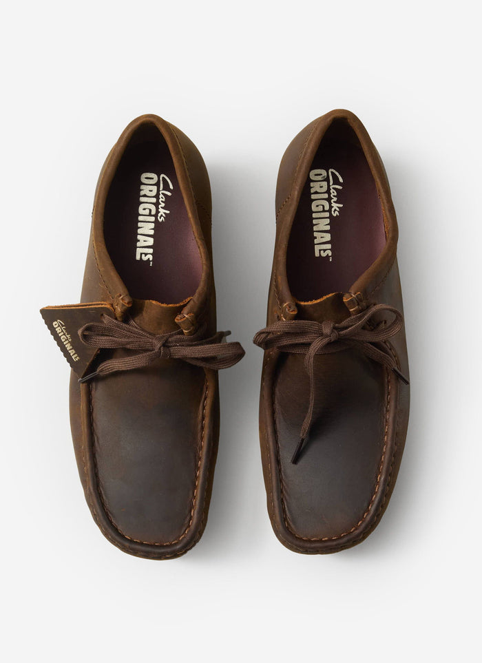 A top-down shot of the Clarks Originals Wallabee shoes in beeswax brown leather, a classic style available from Percival.