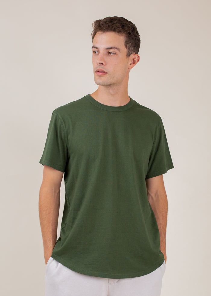 man wearing t-shirt in dark green