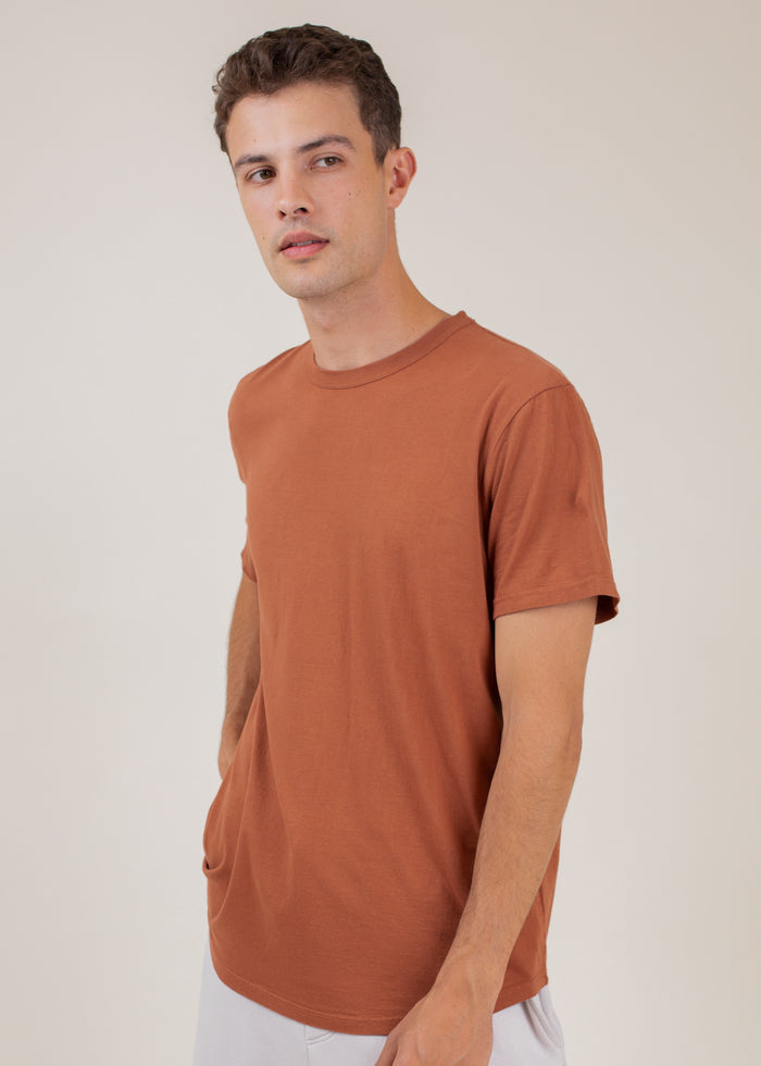 man wearing t-shirt in rust