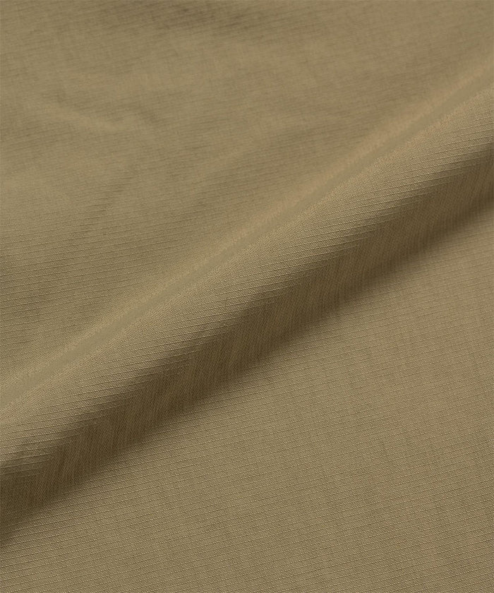 Khaki colored Gramicci Convertible Cargo Pants fabric swatch.