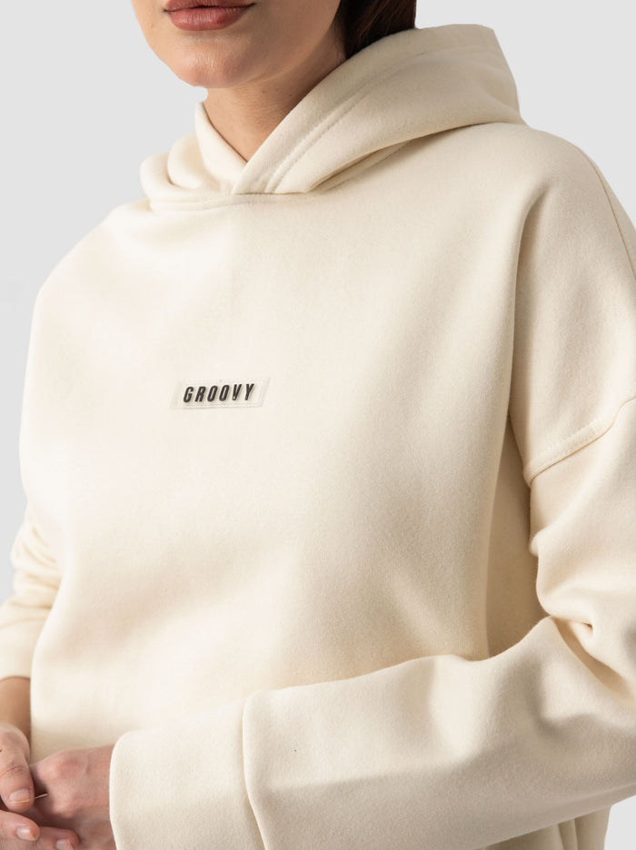 Cream hoodie female model back view oversized streetwear Pakistan – GROOVY