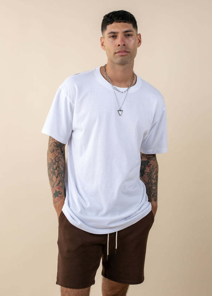 man wearing oversized deadstock tee in white