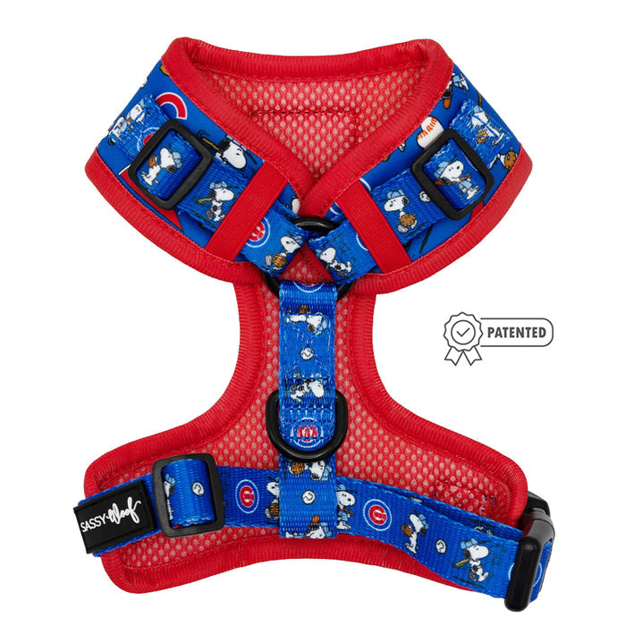 The Sassy Woof Dog Adjustable Harness – MLB™ x Peanuts™ Chicago Cubs™ features blue and red straps with Snoopy and Cubs logos, a black buckle, and a Patented badge—perfect for your pup to rep the Cubs in style.