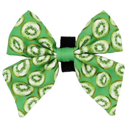 The Sassy Woof Dog Sailor Bow - Kiwi Krazy features a playful sliced kiwifruit pattern and a classic bow style—an adorable, vibrant accessory for your dog.