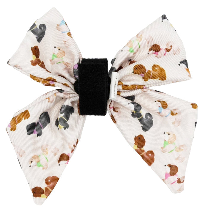 Add playful charm to your dog’s look with the Sassy Woof Dog Sailor Bow - Spunky Shih Tzus, a white bow with a black center featuring colorful cartoon shih tzus—perfect for accessories or pairing with our adjustable harness.