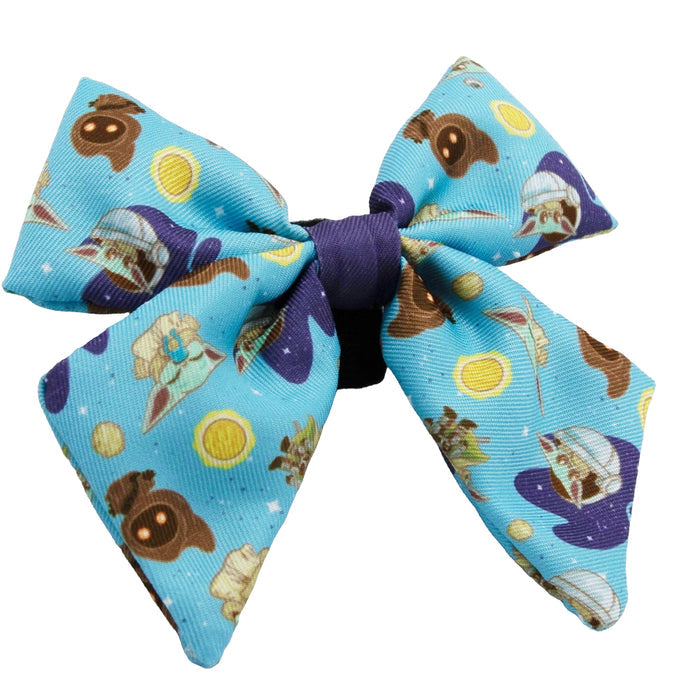 The Sassy Woof Dog Sailor Bow - STAR WARS™ The Mandalorian™ features Baby Yoda, brown frogs, and yellow circles on a light blue background—a playful accessory that pairs well with an adjustable harness or waste bag holder.