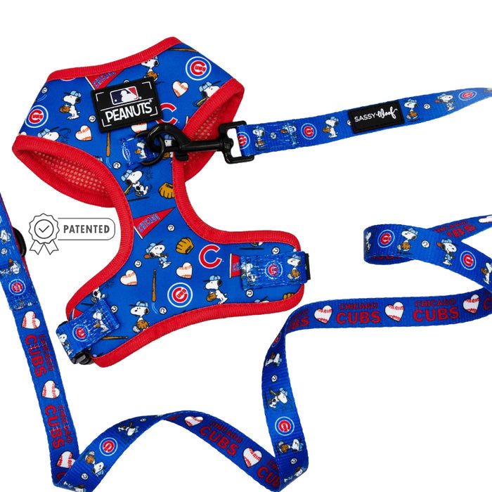 The Dog Two Piece Bundle - MLB™ x Peanuts™ Chicago Cubs™ by Sassy Woof features Snoopy, Cubs logos, hearts, and baseballs on a white background. Includes a patented label and Sassy Woof branding.