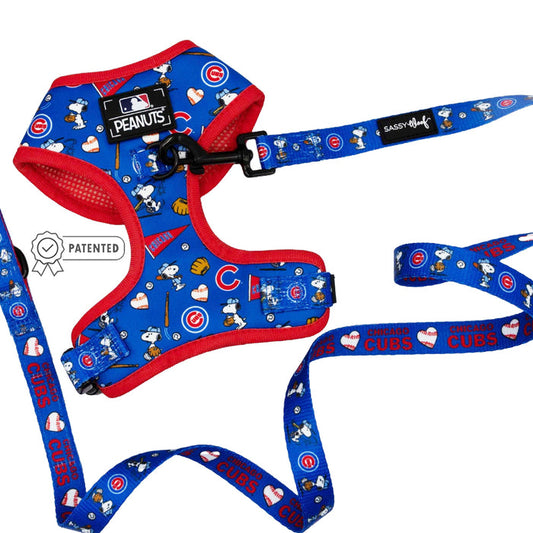 The Dog Two Piece Bundle - MLB™ x Peanuts™ Chicago Cubs™ by Sassy Woof features Snoopy, Cubs logos, hearts, and baseballs on a white background. Includes a patented label and Sassy Woof branding.