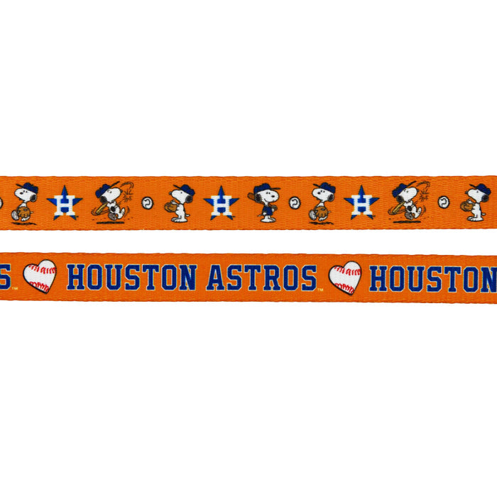 This Sassy Woof Harness Three Piece Bundle features two orange ribbons: one with Snoopy in a cowboy hat and baseballs, and one with “HOUSTON ASTROS” in blue and orange—part of the MLB™ x Peanuts™ Houston Astros™ collection.