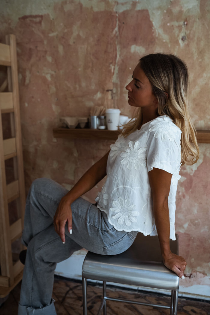 Model wearing ecru Ellea blouse