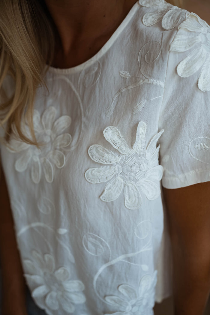 Ecru Ellea blouse scalloped hem detail