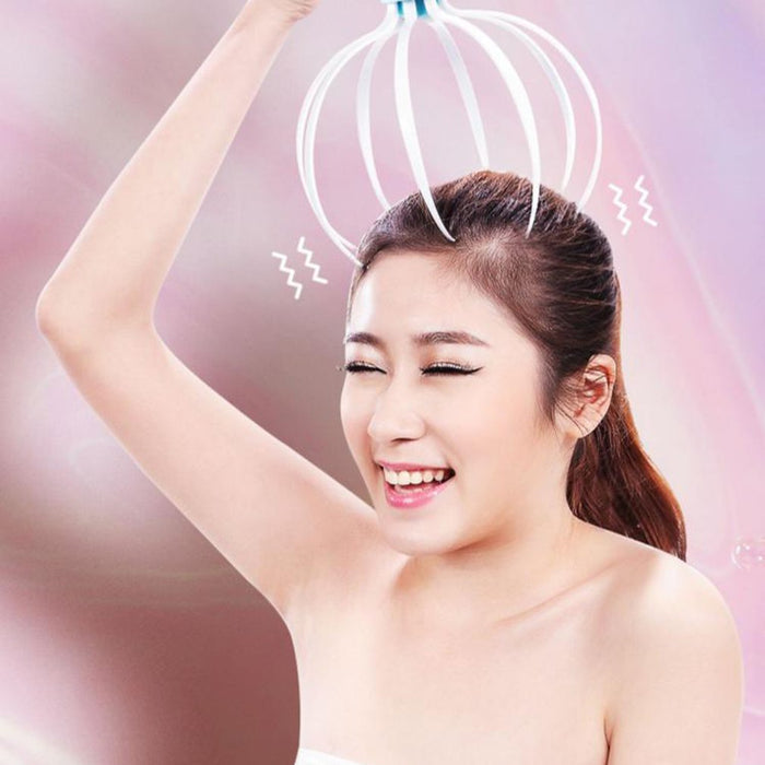 Electric scalp massager shown in use on the head as a compact USB rechargeable device for home, desk or travel care routines.