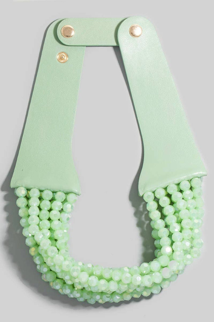 Style the Faux Leather And Faceted Beads Statement Necklace exclusively at Born To Glam