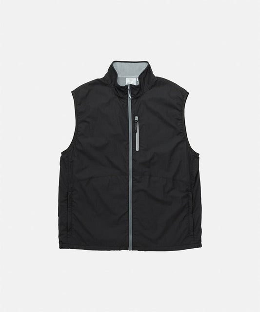Gramicci black Flyweight Vest against a light-tone background.