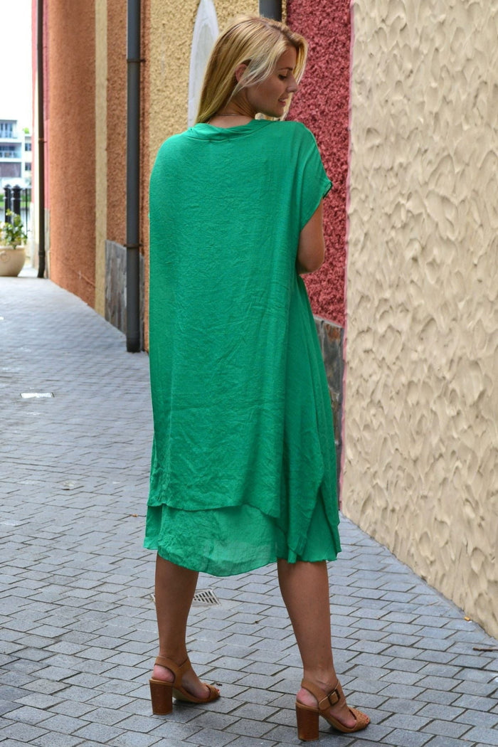 Grass green Wishstone drop shoulder tunic dress displayed on model, featuring a relaxed fit and stylish design.
