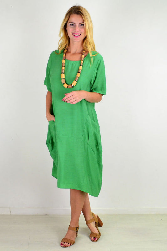 Green Grass Pocket Bubble Tunic Dress by La Mode, featuring a relaxed fit with pocket details and bubble silhouette.