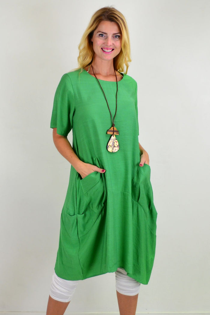 Green Grass Pocket Bubble Tunic Dress by La Mode, featuring a loose fit with pocket details and a bubble hem, displayed on a mannequin.