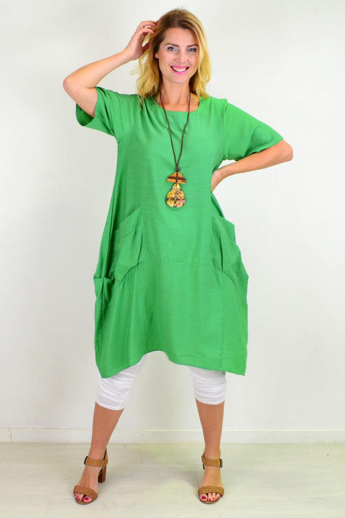 Green Grass Pocket Bubble Tunic Dress by La Mode, featuring a relaxed fit, vibrant green fabric, and front pocket detail.