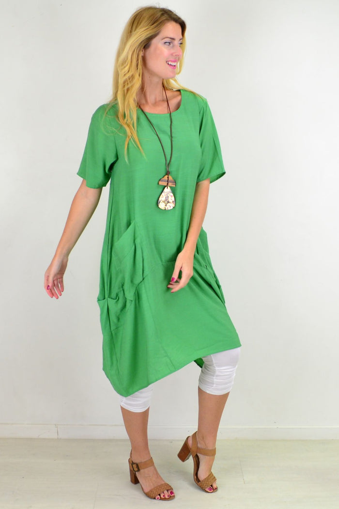 Green Grass Pocket Bubble Tunic Dress by La Mode, featuring a relaxed fit, bubble silhouette, and front pockets in a vibrant green fabric.