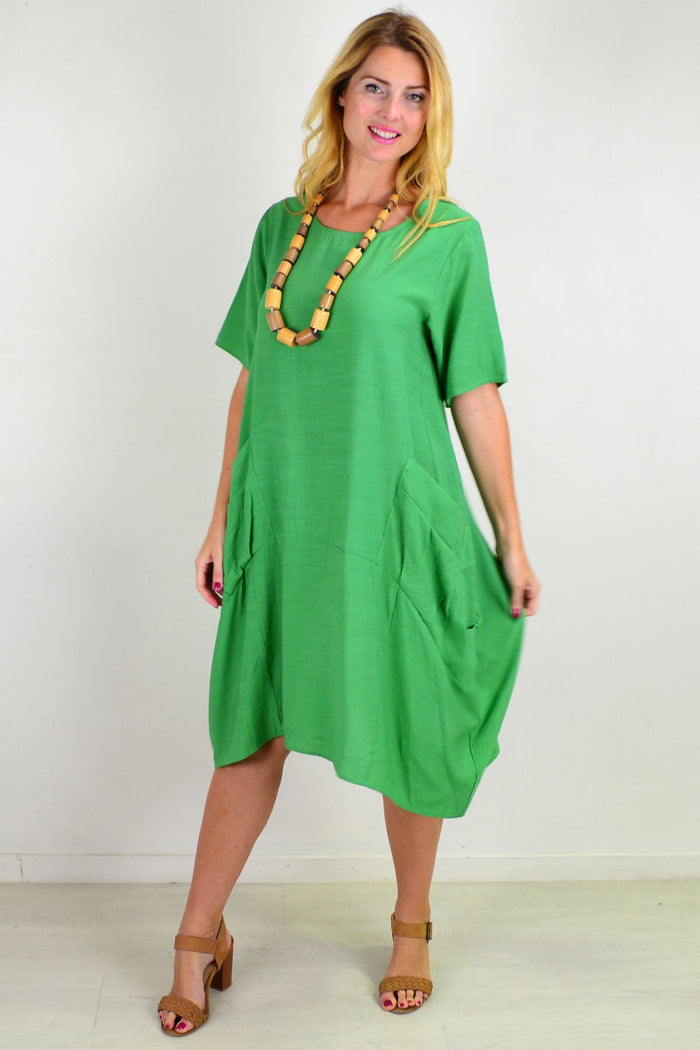 Green Grass Pocket Bubble Tunic Dress by La Mode, showcasing a relaxed fit with pocket details and bubble silhouette.