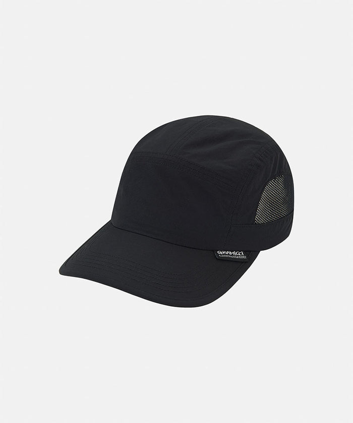 Black Gramicci Guide Cap against a light-tone background.