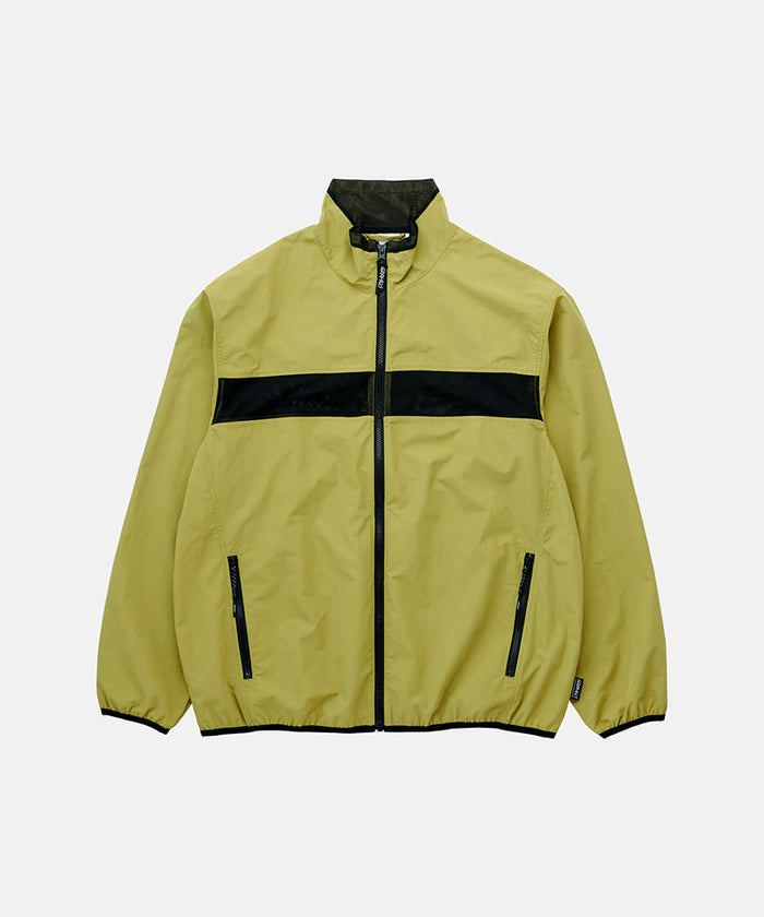 Gramicci field green Gramicci Guide Jacket against a light-tone background.