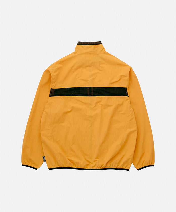 Back view of the Gramicci Guide Jacket in mango featuring a horizontal black mesh vent and elasticated hem on a light tone background.