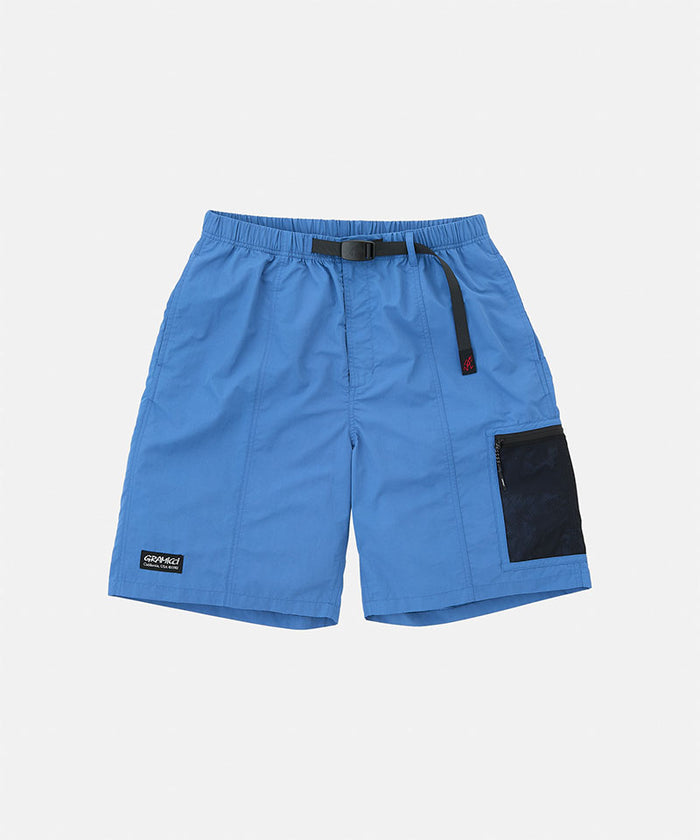 Navy blue Gramicci Guide Shorts with a black belt and black accents against a light-tone background.