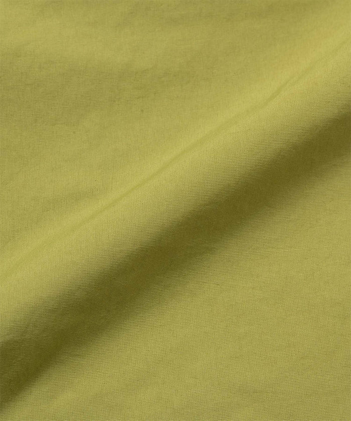 Gramicci field green colored Guide Shorts fabric swatch.