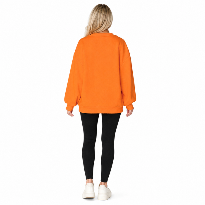 Back view of orange women's Halloween sweatshirt showing plain rear and long sleeves, photographed on a clean white backdrop.