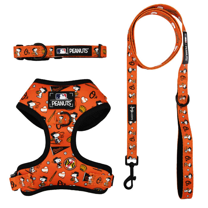 The Sassy Woof Harness Three Piece Bundle - MLB™ x Peanuts™ Baltimore Orioles™ features a Snoopy dog harness, collar, and leash with baseball-themed designs—ideal for puppy fans. Displayed on a white background.