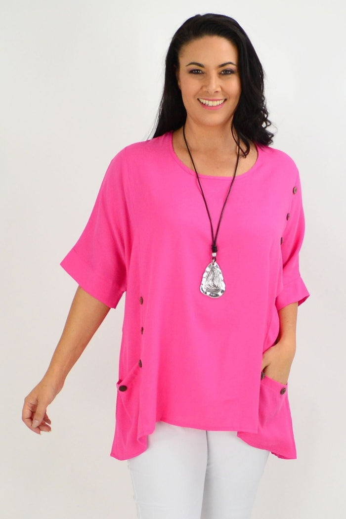 Hot pink coconut button sloping sleeve tunic top by Wishstone, featuring a stylish design and sloped sleeves.