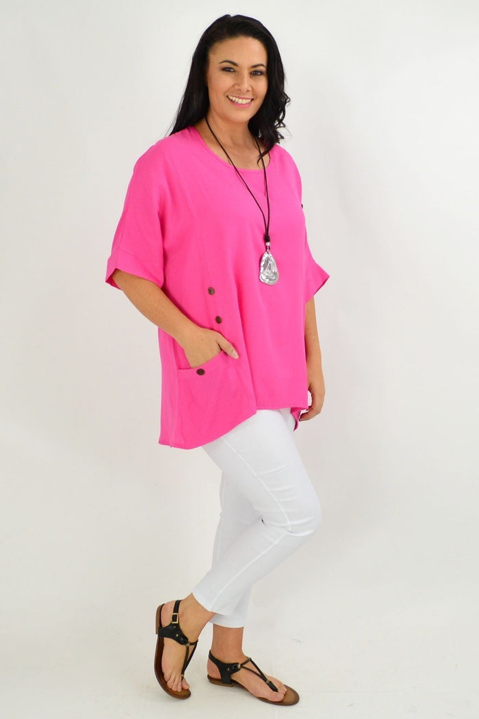 Hot pink coconut button sloping sleeve tunic top by Wishstone, featuring a relaxed fit and stylish design.