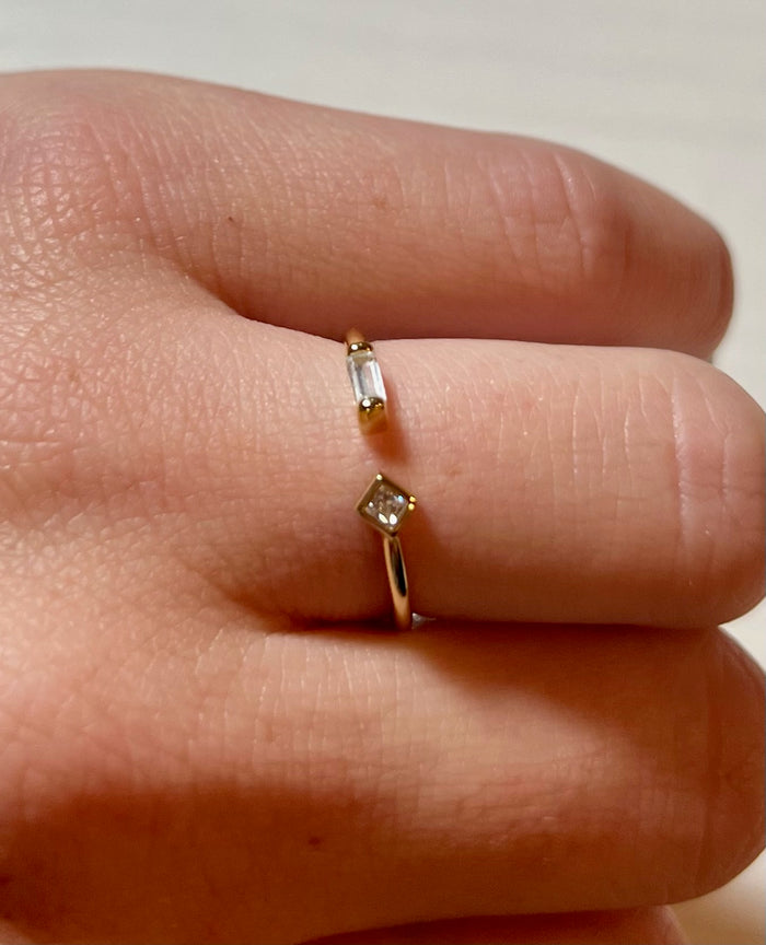 Adjustable gold sparkly ring being worn