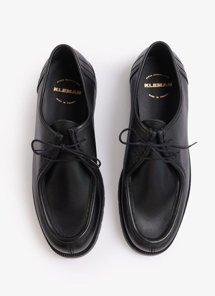 A pair of black Kleman Padror leather shoes from Percival, seen from above against a white background.