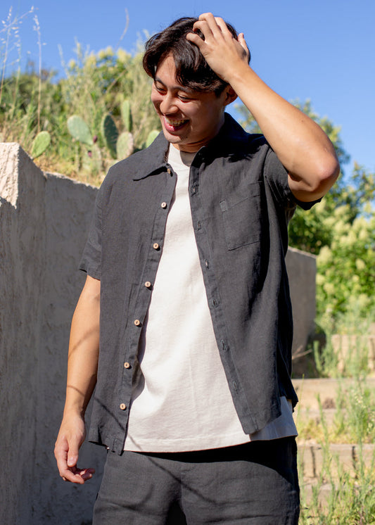 man wearing dark grey linen button down